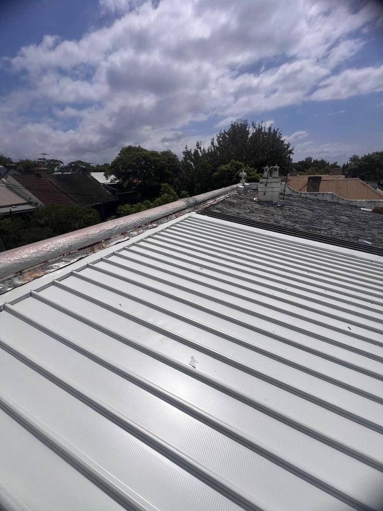 Standing seam metal roof installed by Auscity Roofing